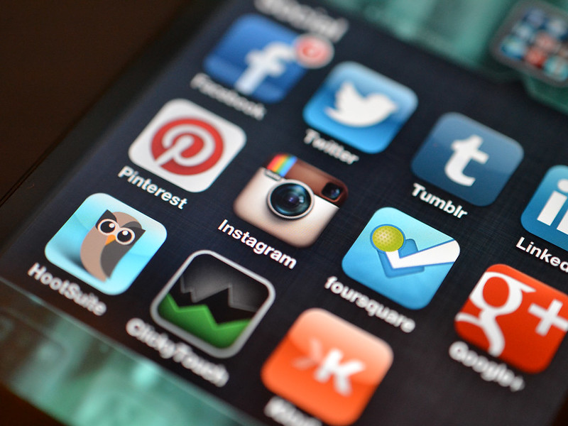 Image shows a variety of social media apps on a person's phone