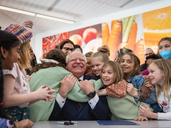 Tim Walz being mobbed by children after signing school lunch bill in Minnesota