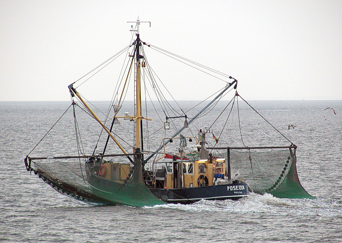 Image is a commercial fishing boat on the water